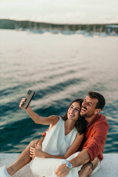 istock Enjoying summer over a smartphone together 2172768071