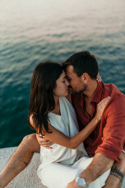 istock Kissing over a sea 2172768489
