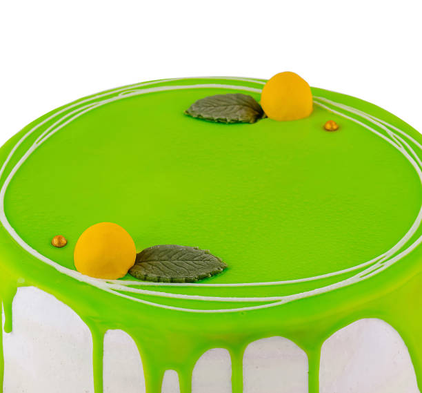 istock Delicious birthday cake covered with green icing on white background 2172772593