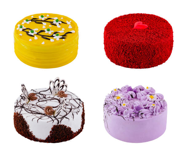 Four delicious colorful cakes decorated with chocolate, flowers and a heart are waiting for the birthday party