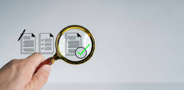 istock Magnifying glass focus to Approve document icon on white background 2172773390