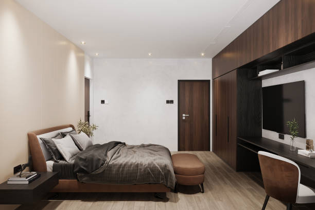istock Chic modern bedroom featuring a spacious bed, sleek sliding closet doors, and an inviting view into an adjacent room 2172781902