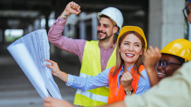 istock Excited Construction Team Celebrating Success on Site 2172787094