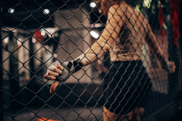 istock Female athlete readying herself before MMA training session 2172791280
