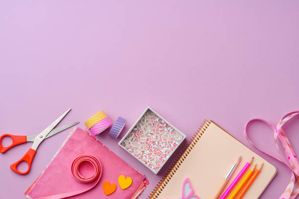 istock Crafting supplies on a purple background ready for creative projects 2172793461