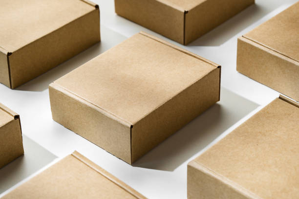 istock Brown cardboard boxes arranged on a light surface for packing goods in a warehouse setting 2172793624