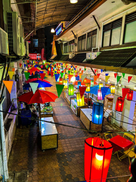 istock A small street decorated with colorful lanterns. 2172796375