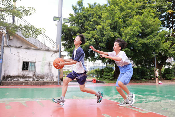 istock Two boys playing basketball 2172797751