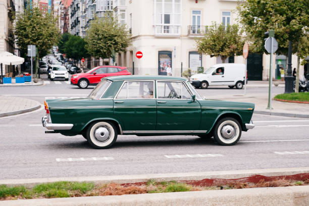 A vintage car in a city