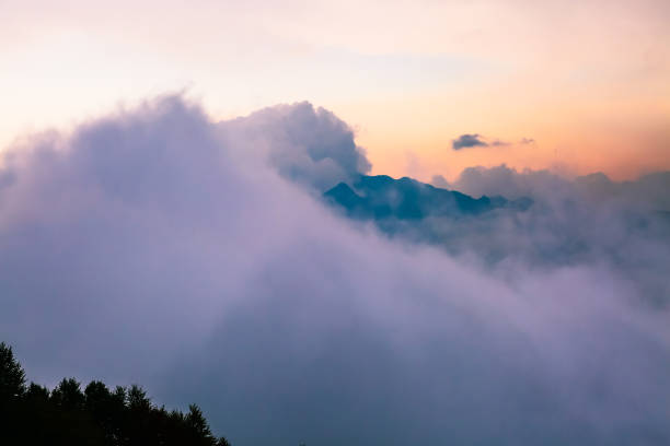 istock Mountain peaks in the clouds at sunset 2172799483