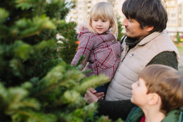 istock Family choosing Christmas tree 2172801547