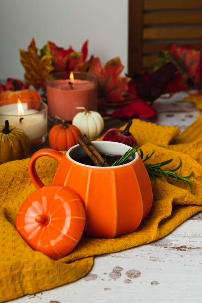 istock Pumpkin cup of autumn mulled wine with cinnamon on rustic table 2172801576