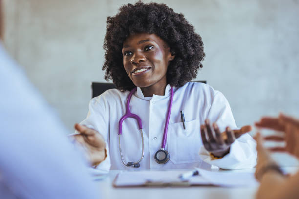 istock Friendly Doctor Engaging in a Consultation with Patients 2172801826