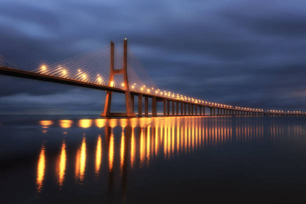 istock illuminated bridge in Lisabon before sunrise 2172801999