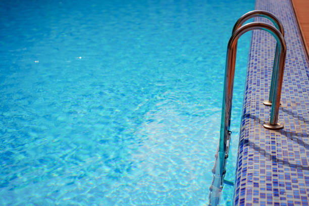 istock ladder for descending into the pool 2172803007
