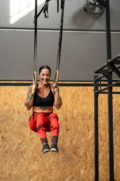 istock Woman training with rings in a cross training gym 2172805002
