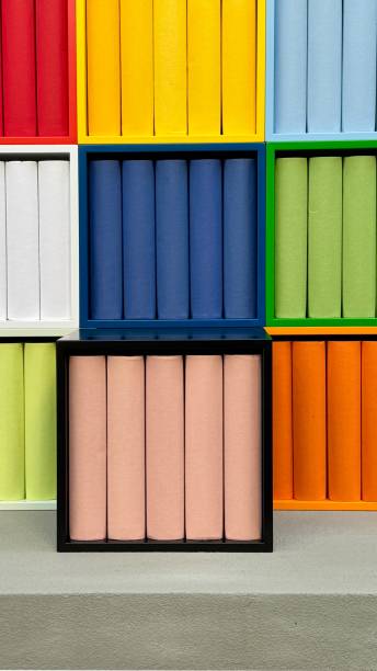 istock Tower of colorful boxes filled with book replicas 2172809576