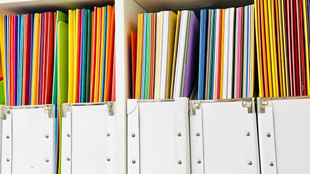 istock View into the storage room, colorful papers in white boxes 2172810271