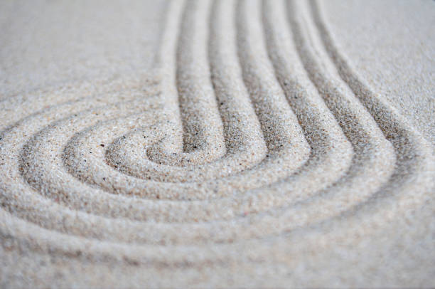 istock lines and circle formation on beach sand with customizable space for text 2172814364