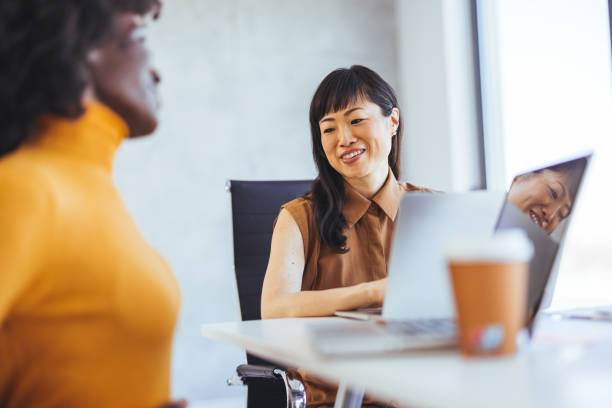 istock Diverse Businesswomen Collaborating in Modern Office Setting 2172815683
