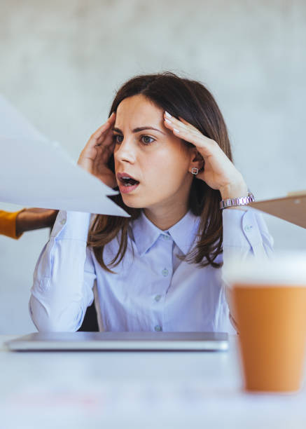 istock Stressed Businesswoman Overwhelmed with Work and Paperwork 2172815890