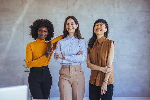 istock Confident Diverse Women in Professional Attire Smiling Together 2172815909