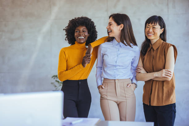 Diverse Group of Women Smiling in an Office Setting
