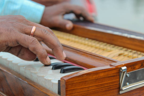 istock Close Up Of Hand Playing Harmonium 2172816222