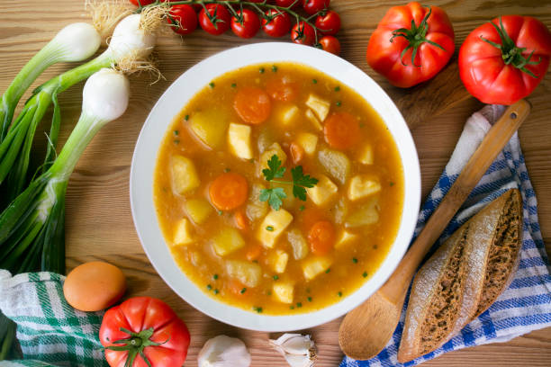 istock Squid stew with potatoes and vegetables. Top view table with decoration. 2172817226