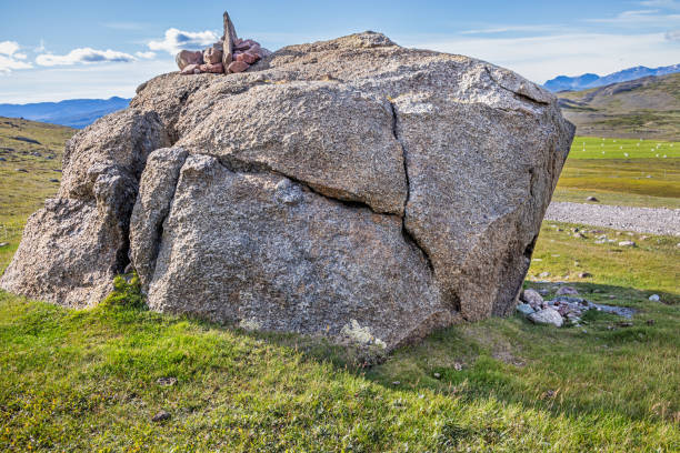 Frost-cracked rock with a cairn on top outside Itelleq which is a small village famous for its sheep farming in the south western part of Greenland.
