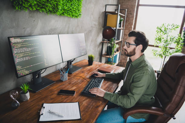 istock Photo of successful intelligent nice man hardware expert hacker work with server pc indoors 2172820677