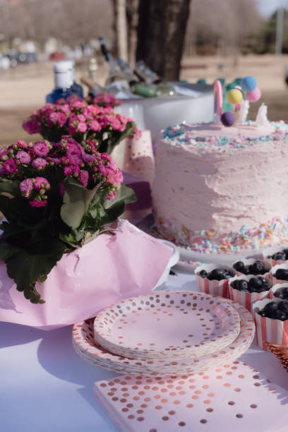istock Rainbow Birthday Cake on Table in Park 2172823098