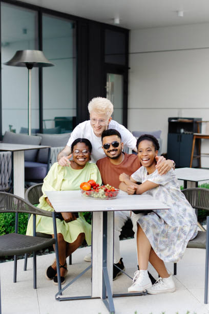 istock Multinational friends having fun in outdoor cafe in summer time 2172827509
