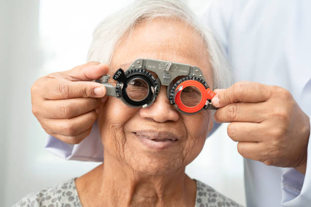 istock Asian senior woman wearing ophthalmic vision eye test and using optical trial frame. 2172829063