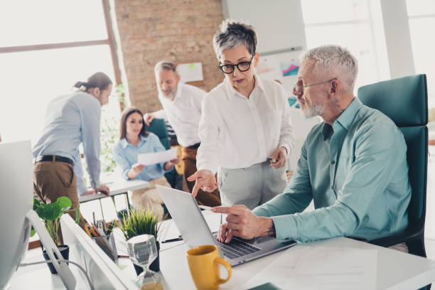 istock Photo of teamwork startup partners networking discussion netbook comfortable nice creative startup office loft room interior 2172837274