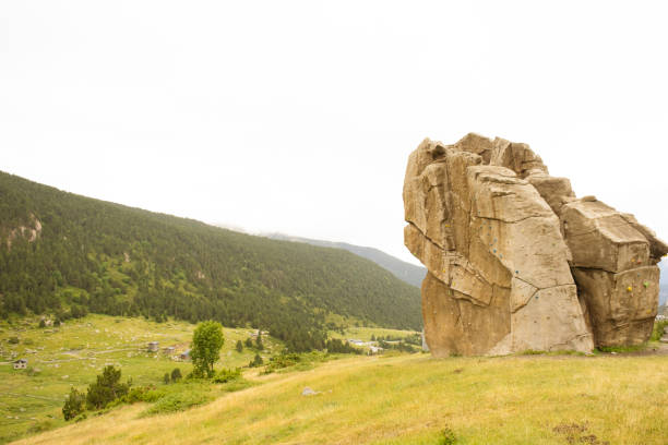 istock Large rock with climbing elements in the middle of the mountains. 2172837933