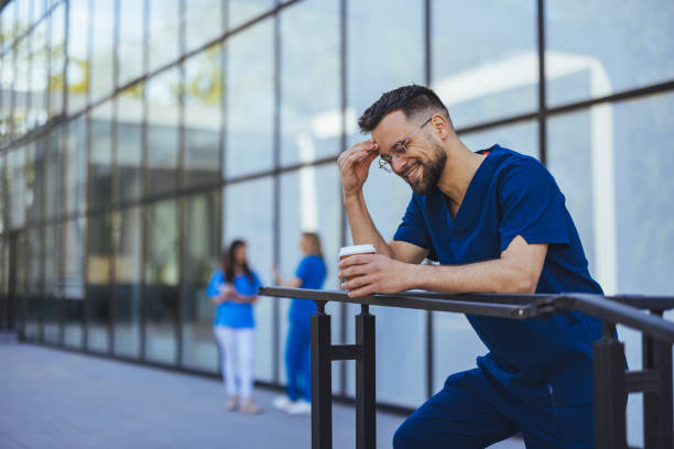 istock Smiling Medical Professional Taking a Break Outdoors 2172838014