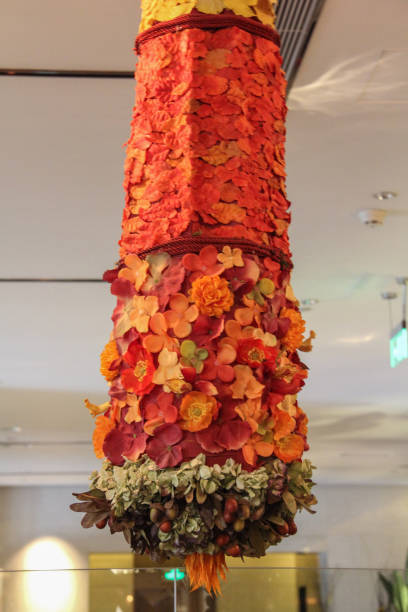 A column of dried colorful flowers in an orderly arrangement