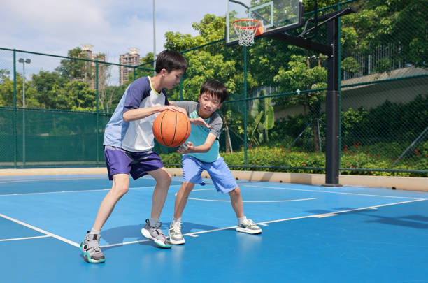 istock Kids are playing basketball 2172844068