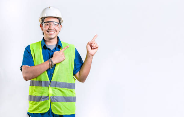 istock Happy male engineer pointing to side isolated. Smiling male engineer pointing blank space isolated 2172848731