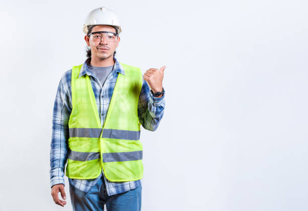 istock Male construction engineer pointing at an advertisement. Engineer man pointing side isolated. Male builder pointing finger to the right isolated 2172848746