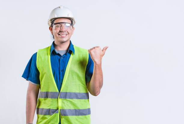 istock Portrait of engineer man pointing to side isolated. Smiling engineer man pointing side isolated 2172848748