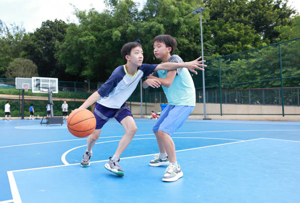 istock Kids are playing basketball 2172850322