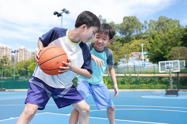 istock Two boys playing basketball 2172850370