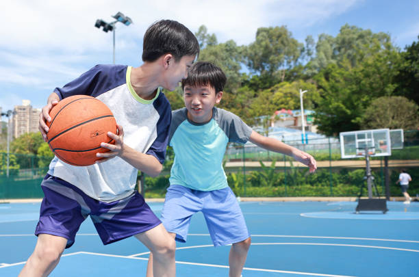 istock Kids are playing basketball 2172850372