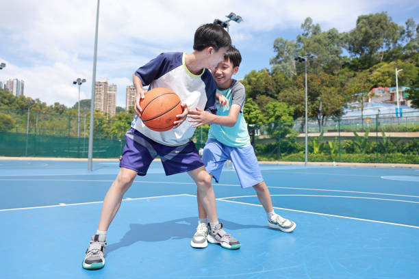istock Kids are playing basketball 2172850415