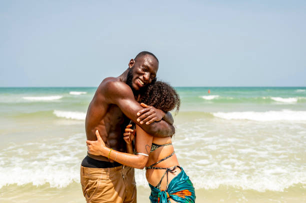 istock Happy Couple Embracing on a Sunny Beach Day 2172851661