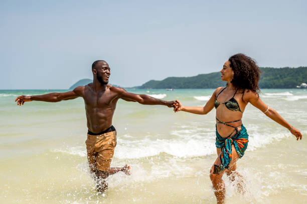 istock Happy Couple Enjoying Playful Day at Sunny Beach 2172851664