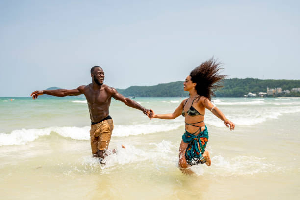 istock Happy Couple Enjoying a Fun Day at the Beach 2172851669