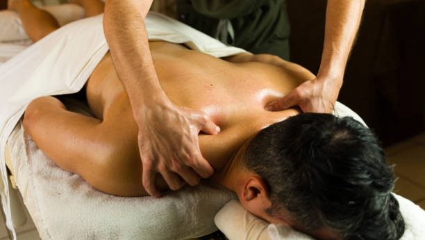 istock Man receiving a relaxing back massage from a male masseur on a massage table in a spa 2172854849